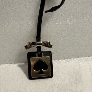 Kate Spade black/gold bag charm
